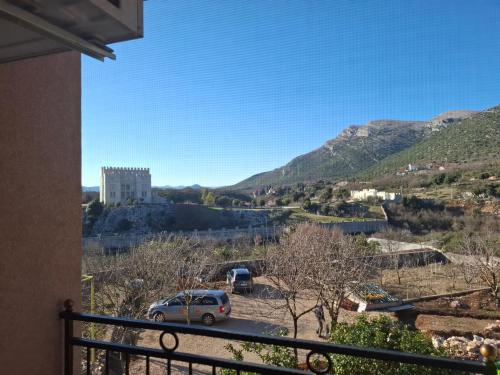 a view from the balcony of a house with a car at Apartments Pravica Trebinje in Trebinje