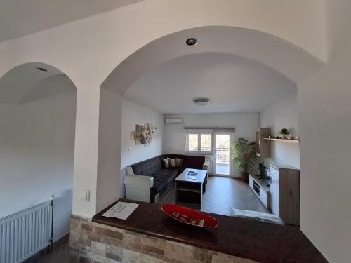 a living room with a couch and a table at Apartments Pravica Trebinje in Trebinje
