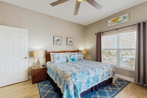 a bedroom with a bed and a ceiling fan at Madeira Bay Resort 509 in St Pete Beach