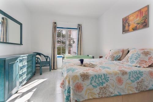 En eller flere senge i et værelse på Vanil blanco