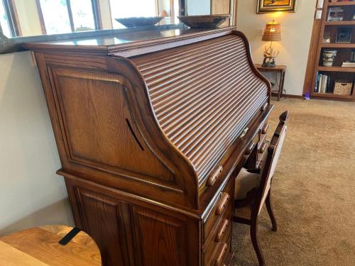 a large wooden organ in a living room at Aspen Chalet 976 in Aspen
