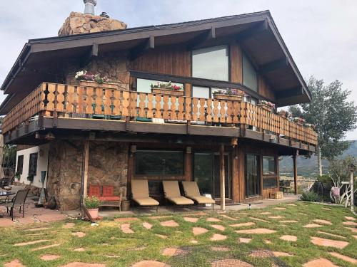a large house with a balcony on top of it at Aspen Chalet 976 in Aspen