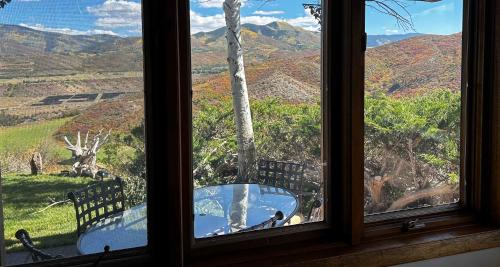 a window with a view of a mountain view at Aspen Chalet 976 in Aspen