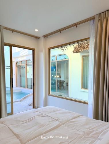 Voodi või voodid majutusasutuse บ้านเพื่อนหัวหิน BAAN PUEAN Pool Villa toas