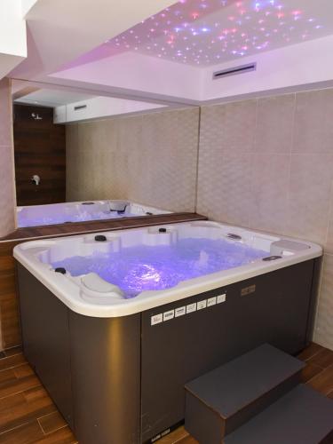 a large blue bath tub in a room at Zlatiborski Konaci in Zlatibor