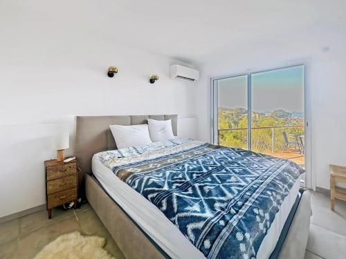 Ένα ή περισσότερα κρεβάτια σε δωμάτιο στο Superbe maison F5 avec vue mer - Plage à 5 min - Climatisation - Wifi gratuit