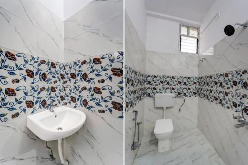 a bathroom with a sink and a toilet at Hotel O Gangotri Inn in Gulzārbāgh