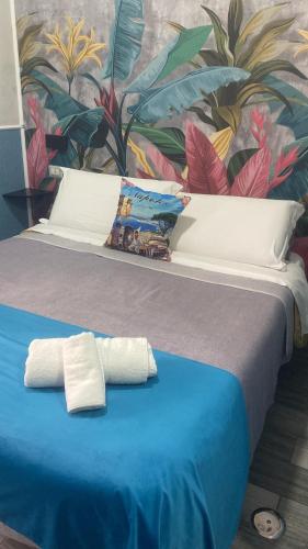 Ένα ή περισσότερα κρεβάτια σε δωμάτιο στο B&B VIVA NAPOLI