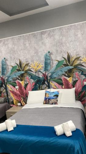Ένα ή περισσότερα κρεβάτια σε δωμάτιο στο B&B VIVA NAPOLI