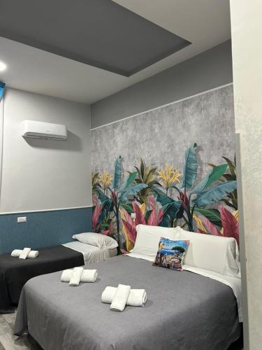 Ένα ή περισσότερα κρεβάτια σε δωμάτιο στο B&B VIVA NAPOLI