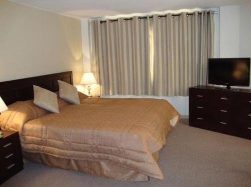 Ένα ή περισσότερα κρεβάτια σε δωμάτιο στο Los Sauces Apart Hotel