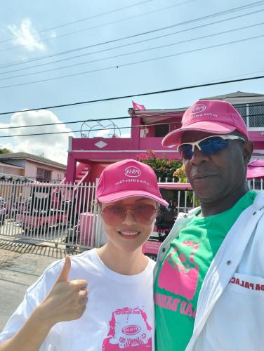 a man and a woman giving a thumbs up at Da Pink And White Palace in Nassau