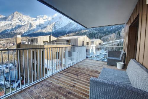 a balcony with a view of the mountains at Apartment Aiguille Rose in Les Houches