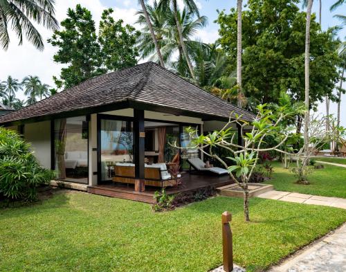 a villa with a pavilion in a garden at Nikki Beach Resort & Spa Koh Samui in Lipa Noi