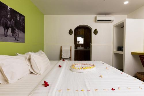 a cake sitting on top of a bed at Green BOUTiQUE in Siem Reap
