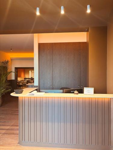 a large kitchen with a counter in a room at Hotel Prado in Ostend