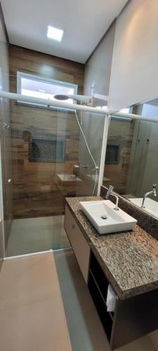 a bathroom with a sink and a shower at White River in Boa Vista