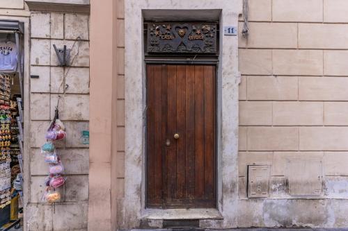 a wooden door on the side of a building at Casa Navona Apartments in Rome