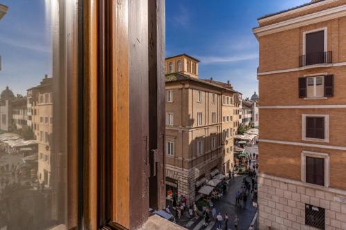 a view of a city street from a window at Casa Navona Apartments in Rome