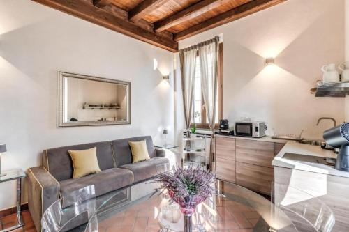 a living room with a couch and a table at Casa Navona Apartments in Rome