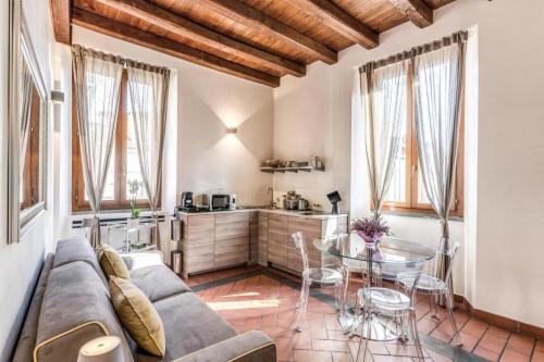 a living room with a couch and a table at Casa Navona Apartments in Rome