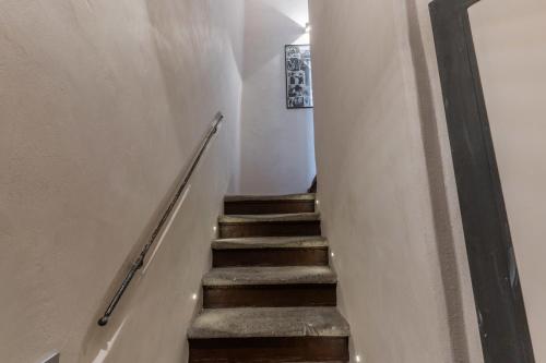 a stairway leading up to a room with white walls at Casa Navona Apartments in Rome