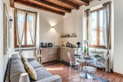 a living room with a couch and a table at Casa Navona Apartments in Rome