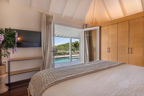 Ένα ή περισσότερα κρεβάτια σε δωμάτιο στο Villa SARONG