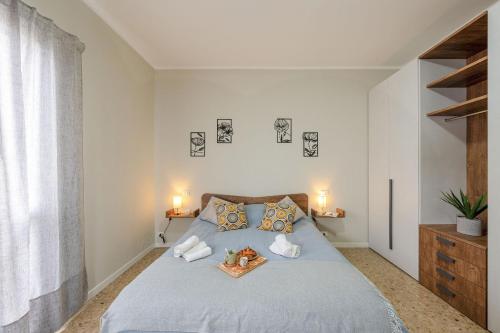 En eller flere senge i et værelse på Italian Experience- Lory House