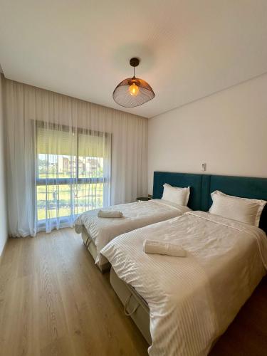 Postel nebo postele na pokoji v ubytování Luxe et Confort à Prestigia Marrakech