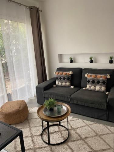 a living room with a couch and a table at Villa W in Cassis