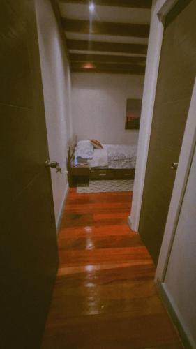 a hallway with a room with a bed in it at Casa Gato in Bocas del Toro