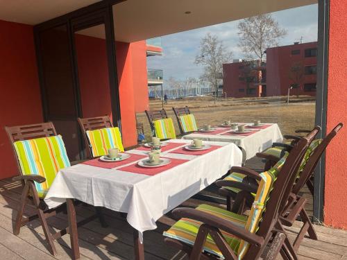 a table and chairs sitting on a patio at BL Residence Balatonlelle in Balatonlelle
