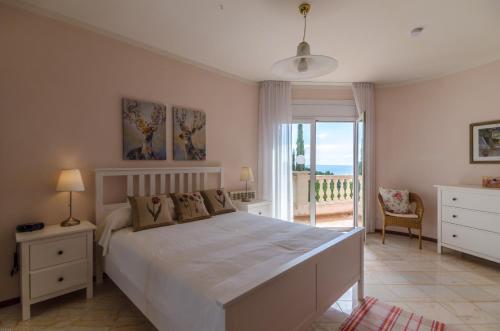 En eller flere senge i et værelse på Club Villamar - Riffelt