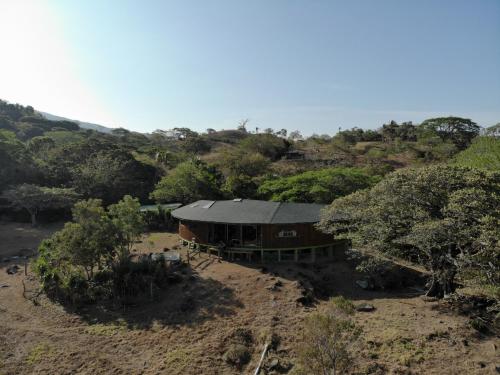 an aerial view of a house in a field at Artistic house in a coffee plantation in Tajo Alto