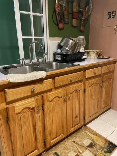 a kitchen with a sink and a counter top at Jade Coast Getaway Near Montego Bay in Montego Bay