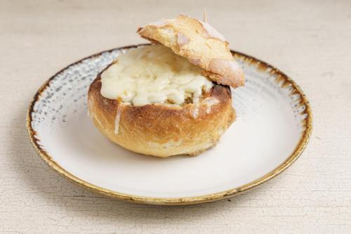 a doughnut sitting on a plate on a table at Intercontinental Real Guatemala by IHG in Guatemala