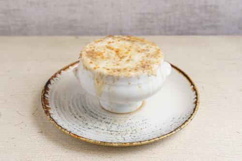 a cup sitting on a plate on a table at Intercontinental Real Guatemala by IHG in Guatemala