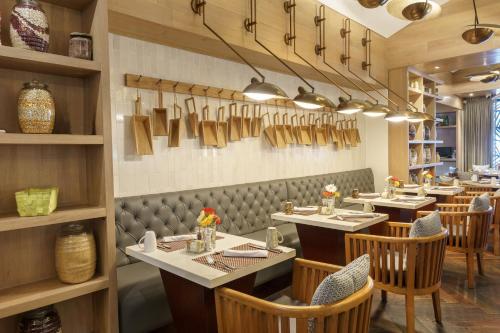a restaurant with tables and chairs in a room at Intercontinental Real Guatemala by IHG in Guatemala