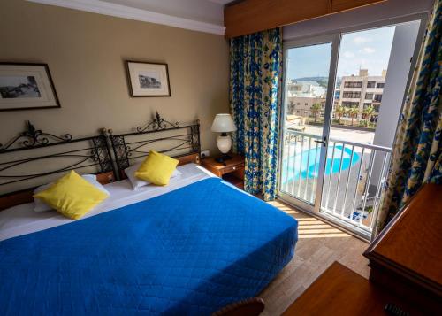 Posteľ alebo postele v izbe v ubytovaní Topaz Hotel