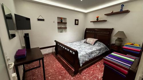 Ein Bett oder Betten in einem Zimmer der Unterkunft Alojamiento en el Centro Histórico