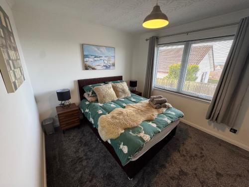 Ένα ή περισσότερα κρεβάτια σε δωμάτιο στο Firth View Heights