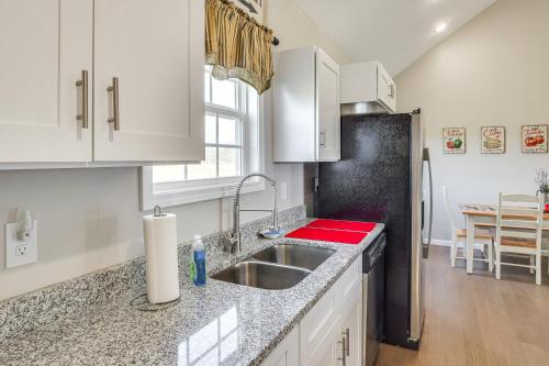 a kitchen with a sink and a refrigerator at Near State Parks and Dtwn Quaint Sparta Home! in Sparta