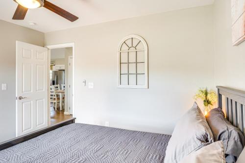 a white bedroom with a bed and a ceiling fan at Near State Parks and Dtwn Quaint Sparta Home! in Sparta