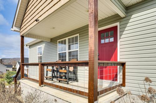 a screened porch with a red door on a house at Near State Parks and Dtwn Quaint Sparta Home! in Sparta