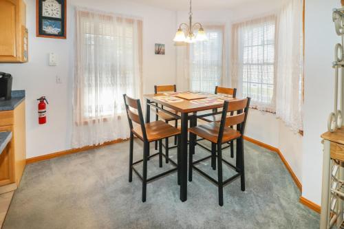 a dining room with a table and chairs at Horseshoe Hideaway - Cozy home with screened porches! in Birch Town