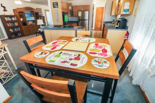 a table with plates on it in a kitchen at Horseshoe Hideaway - Cozy home with screened porches! in Birch Town