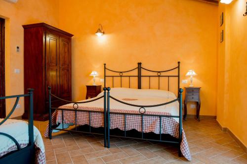 Ένα ή περισσότερα κρεβάτια σε δωμάτιο στο Agriturismo Il Colle del Falco