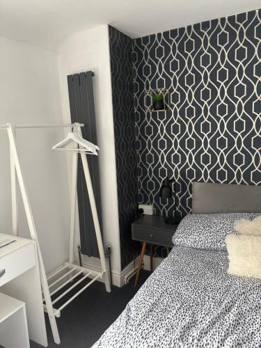 Ένα ή περισσότερα κρεβάτια σε δωμάτιο στο Idan House