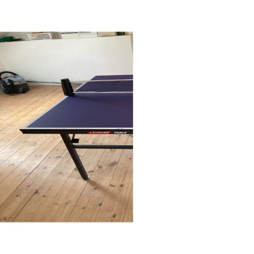 a ping pong table sitting on top of a wooden floor at Beautiful Home In Ørsted W- in Ørsted